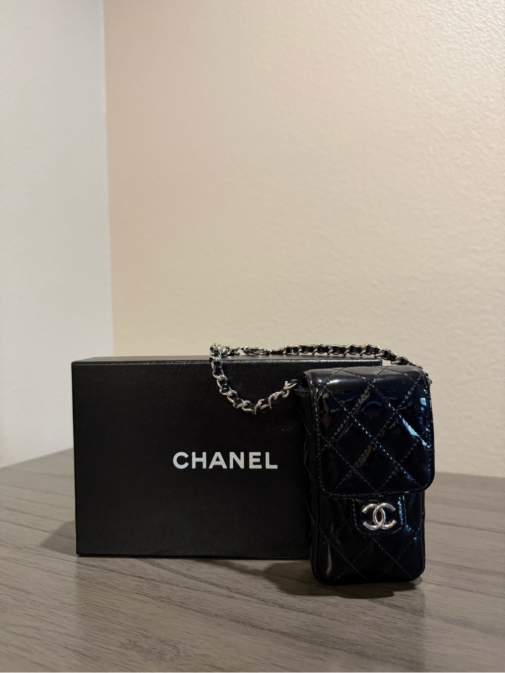 CHANEL Black Patent Leather Quilted Phone Case with Silver Hardware